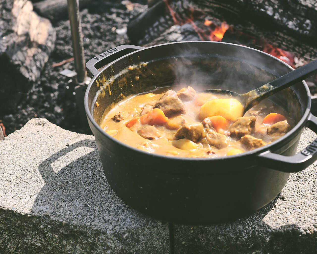 Camping cooking over fire